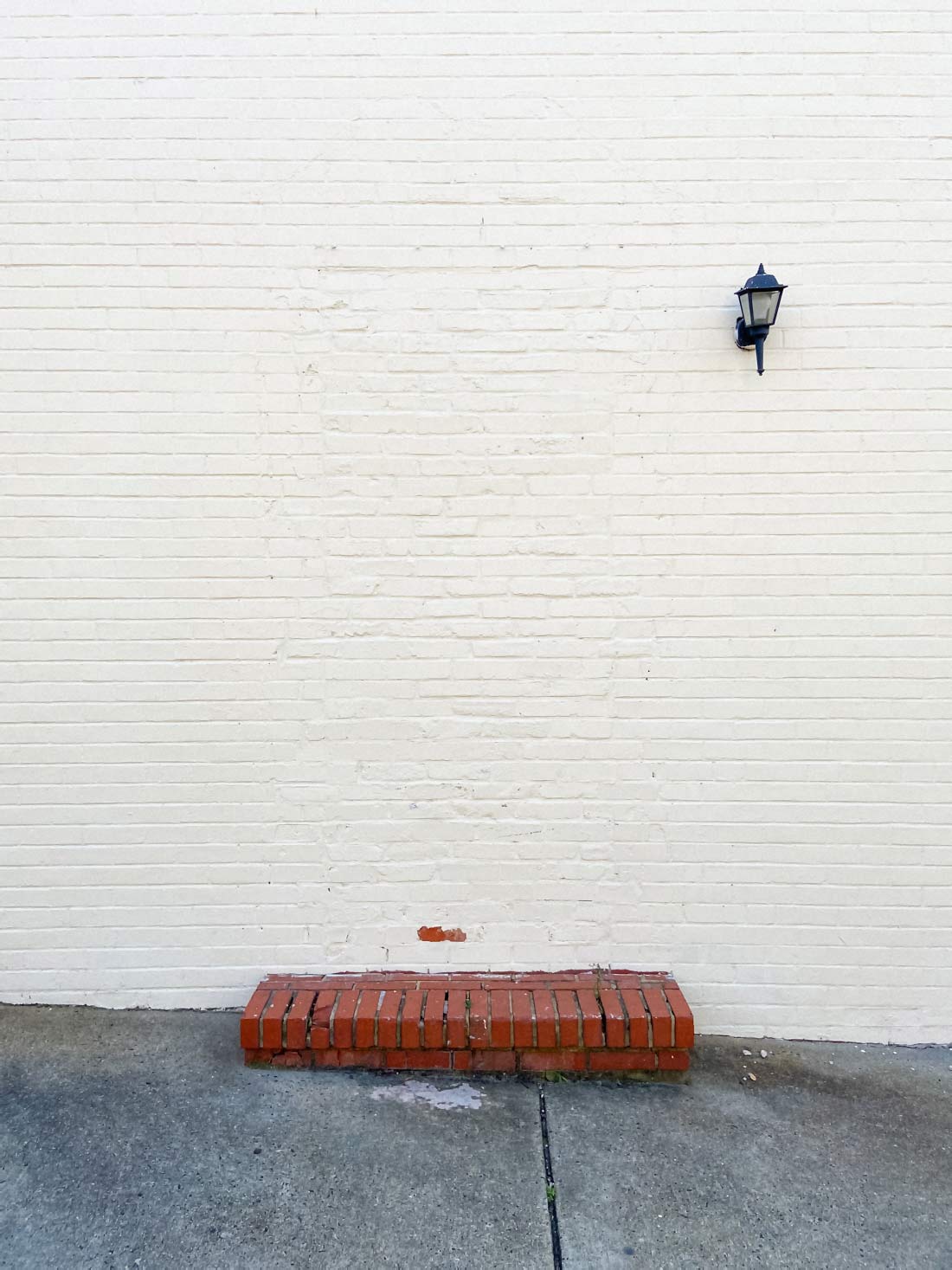 Fine art photo of a white bricked up window or door permanently sealed with bricks © Bruce Willen